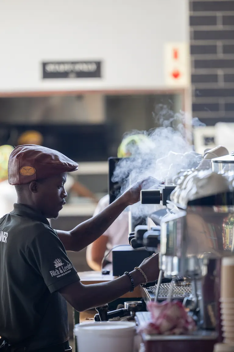 Barista brewing coffee at Blueberry Cafe