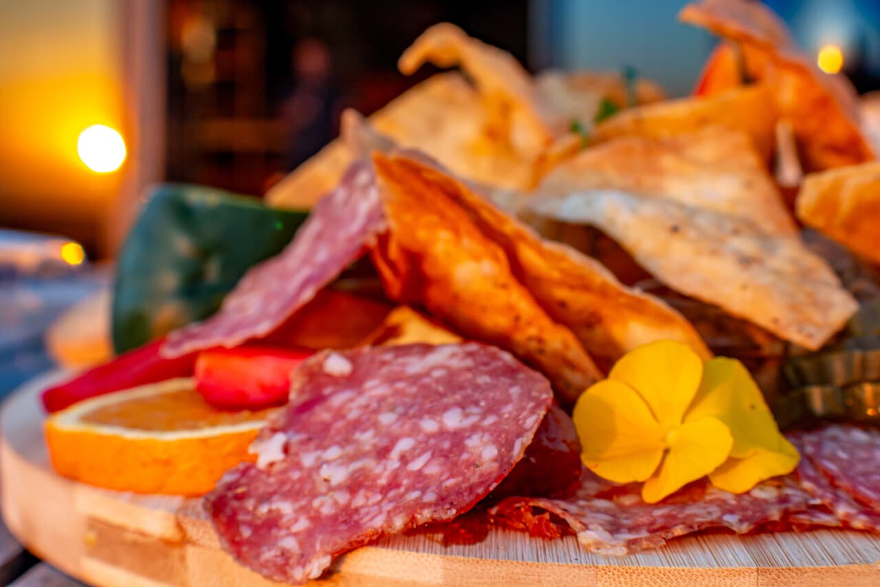 Charcuterie board with salami and flatbread crisps at Blueberry Cafe