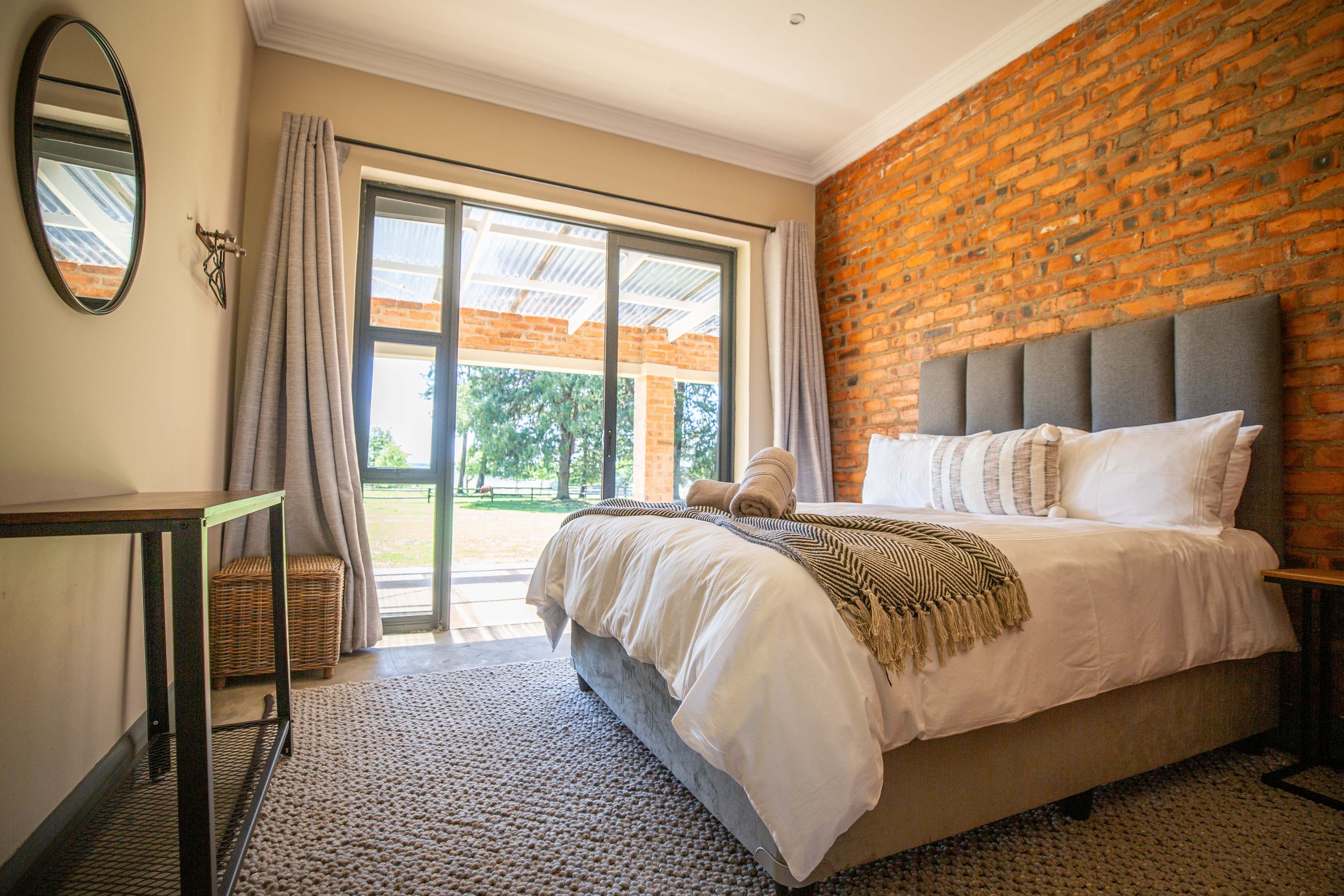 Queen bed and terrace doors in Annex Room 4
